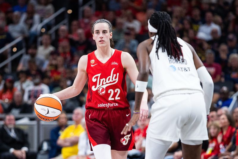 Jun 18, 2026; Indianapolis, Indiana, USA; Indiana Fever guard Caitlin Clark (22) dribbles against Atlanta Dream guard Rhyne Howard (10) in the second half at Gainbridge Fieldhouse. Mandatory Credit: Trevor Ruszkowski-Imagn Images