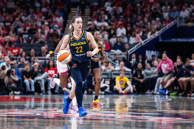 Jun 24, 2026; Indianapolis, Indiana, USA;  Indiana Fever guard Caitlin Clark (22) dribbles  the ball in the second half against the Phoenix Mercury at Gainbridge Fieldhouse. Mandatory Credit: Trevor Ruszkowski-Imagn Images