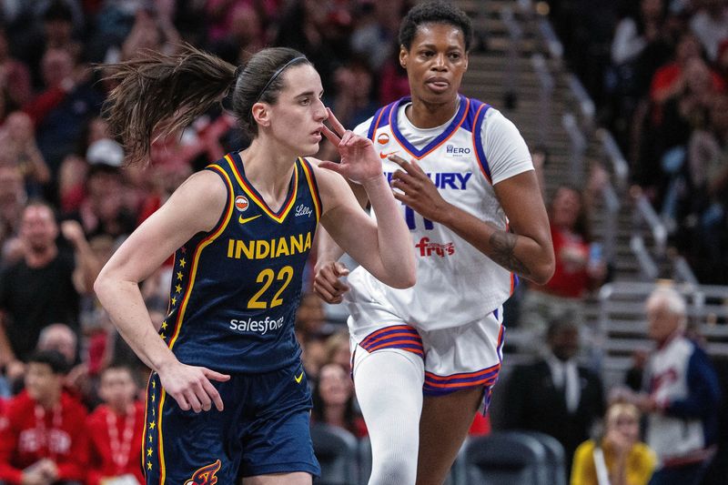 Jun 24, 2026; Indianapolis, Indiana, USA;  Indiana Fever guard Caitlin Clark (22) celebrates a made shot  in the first half against the Phoenix Mercury at Gainbridge Fieldhouse. Mandatory Credit: Trevor Ruszkowski-Imagn Images