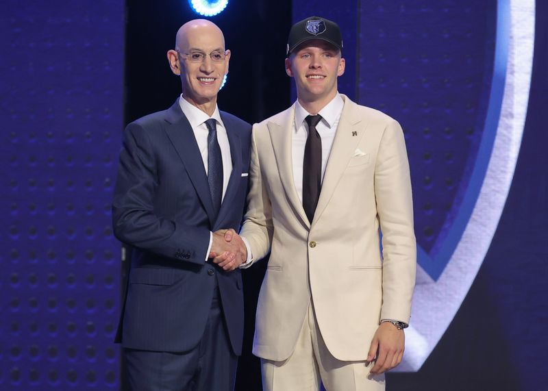 Jun 23, 2026; New York, NY, USA; NBA commissioner Adam Silver greets the sixteenth pick in the 2026 NBA draft, Iowa guard Bennett Stirtz after he was selected by the Memphis Grizzlies at Barclays Center. Mandatory Credit: Brad Penner-Imagn Images