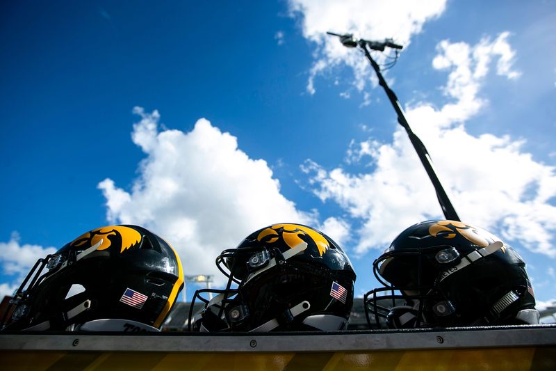 Helmets with Iowa Hawkeyes Tigerhawk logos are seen before a NCAA college football game in the Vrbo Citrus Bowl against Kentucky, Saturday, Jan. 1, 2022, at Camping World Stadium in Orlando, Fla.