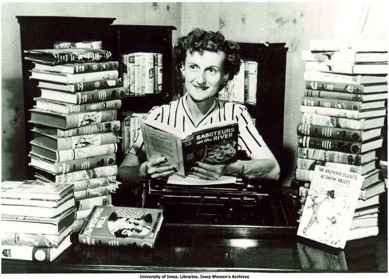 Mildred Wirt Benson in her writing room among her books, Toledo, Ohio, summer 1949.
