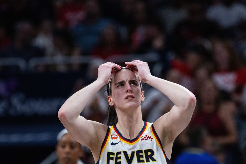 Jun 24, 2026; Indianapolis, Indiana, USA; Indiana Fever guard Caitlin Clark (22) reacts in the first half against the Phoenix Mercury at Gainbridge Fieldhouse. Mandatory Credit: Trevor Ruszkowski-Imagn Images