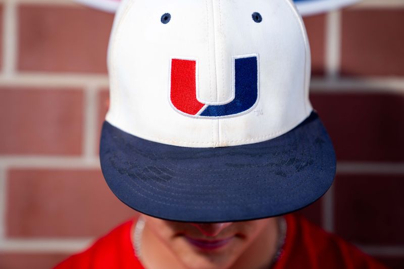 Urbandale’s Xander Gutmann poses for a portrait in the team’s dugout during practice on June 24, at Urbandale High School.
