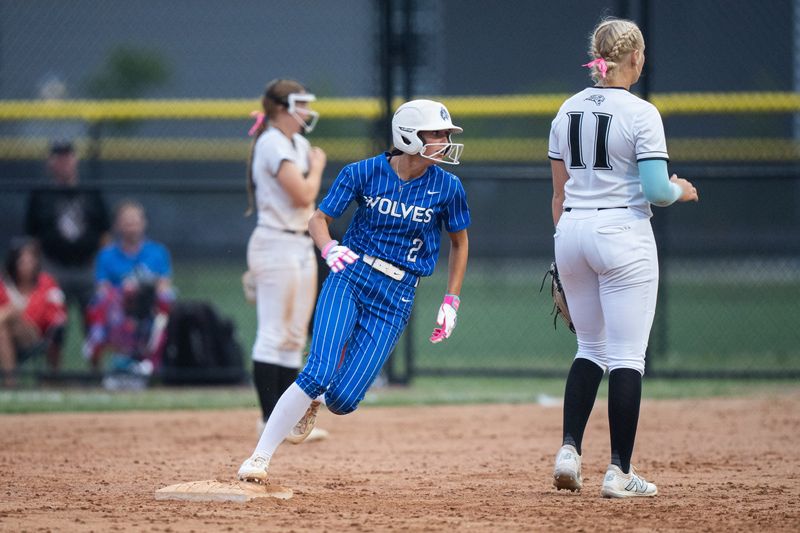 Waukee Northwest's Maggie Allen (2) makes the turn at second base in front of Ankeny Centennial's Mady Ott (11) on June 25, 2026, in Waukee, IA.