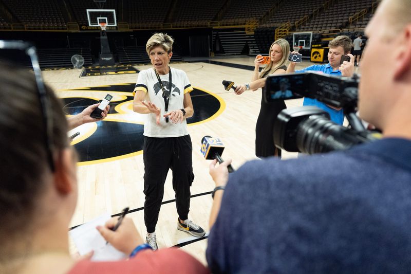 Iowa head coach Jan Jensen talks to reporters after practice on June 25, 2026, at Carver-Hawkeye Arena in Iowa City, Iowa.