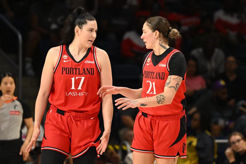 Jun 28, 2026; Washington, District of Columbia, USA; Portland Fire center Megan Gustafson (17) talks with forward Emily Engstler (21) during a time out against the Washington Mystics during the second quarter at CareFirst Arena. Mandatory Credit: Rafael Suanes-Imagn Images