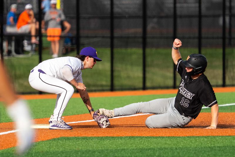 Valley’s Nathan Popovich (16) slides to third base as he’s tagged out by Waukee's Brayden Moore (1)  on June 29, 2026, at Waukee High School.