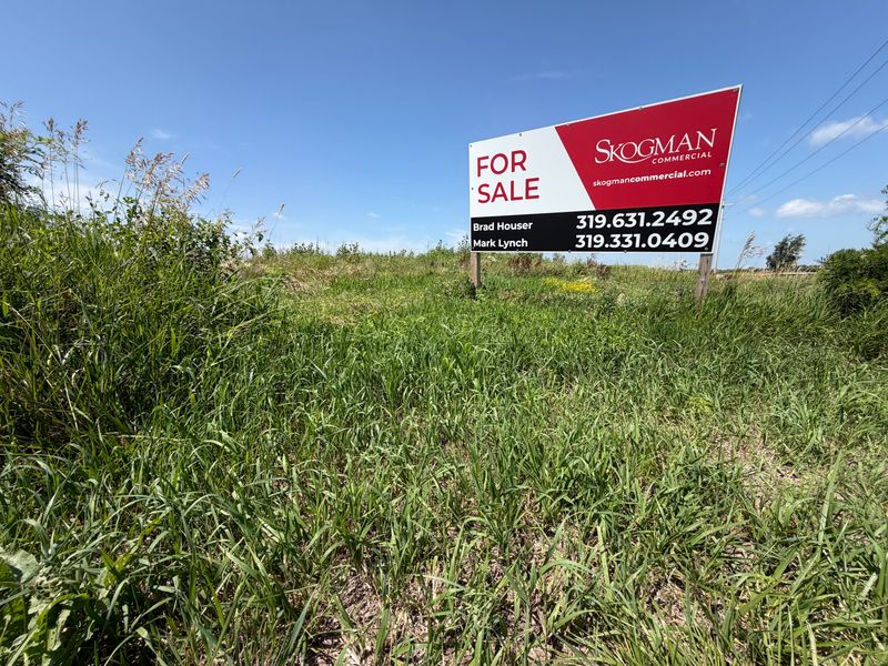 A "for sale" sign is seen on the potential site of the new Johnson County Jail and Sheriff's Office on July 2, 2026. The board of supervisors approved a $2.1 million purchase agreement for the 35-acre lot on July 2.