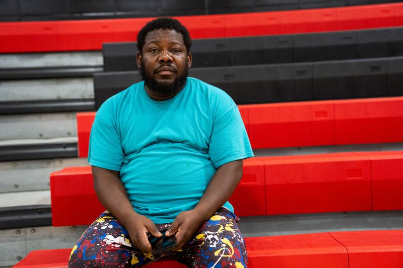 Stanislaus Sesay, a resident at Parkside East Apartments, sits at the Red Cross temporary housing after flooding from Fourmile Creek displaced nearly 144 families from their apartments over the Fourth of July weekend on July 6, 2026, in Des Moines.