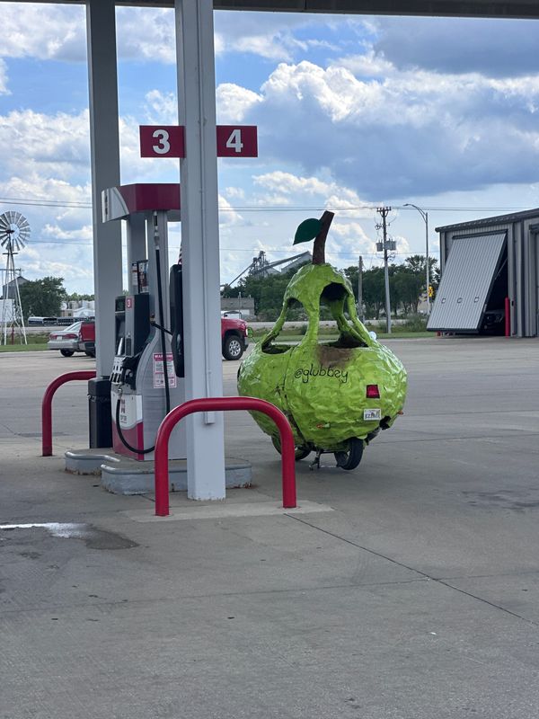 Miss Peary, Andrew Glubbey's pear car, stops for gas June 18 in Iowa.