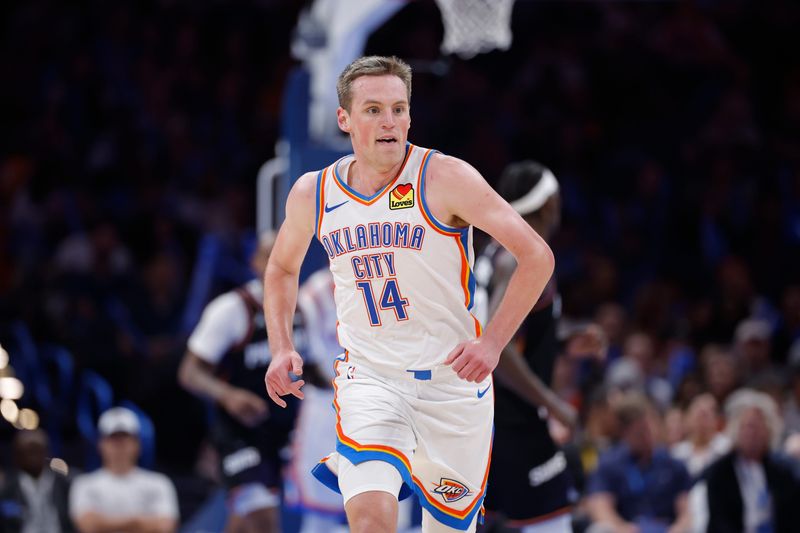 Apr 12, 2026; Oklahoma City, Oklahoma, USA; Oklahoma City Thunder forward Payton Sandfort (14) runs down the court during a game against the Phoenix Suns at Paycom Center. Mandatory Credit: Alonzo Adams-Imagn Images