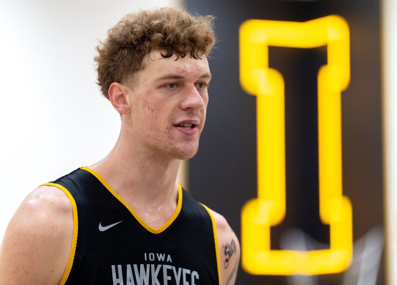 Iowa center Andrew McKeever talks to journalists after a summer basketball practice July 8, 2026 at Carver-Hawkeye Arena in Iowa City, Iowa.