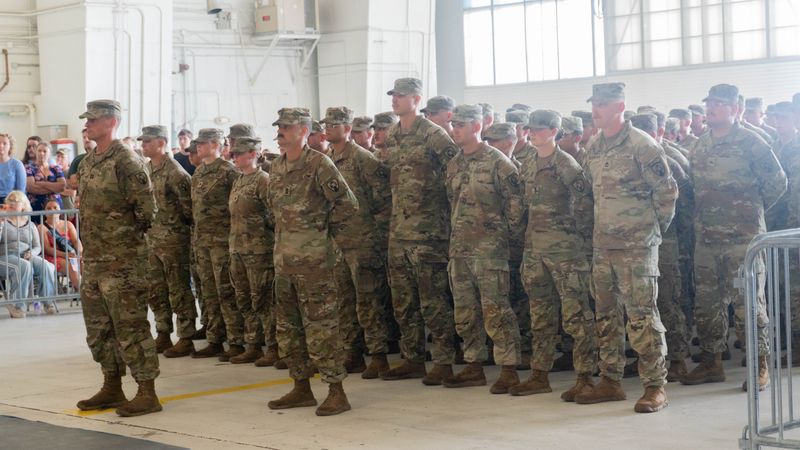 National Guard members stand at parade rest during deployment ceremony on July 10.