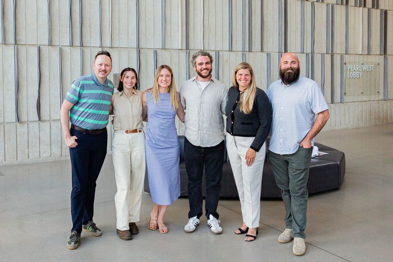 Downtown Iowa City staff members, from left, Joe Reilly, Jackie Jollay, Katie Biegger, Ian Dunbar, Betsy Potter and Christopher Hunter stand for a group photo.