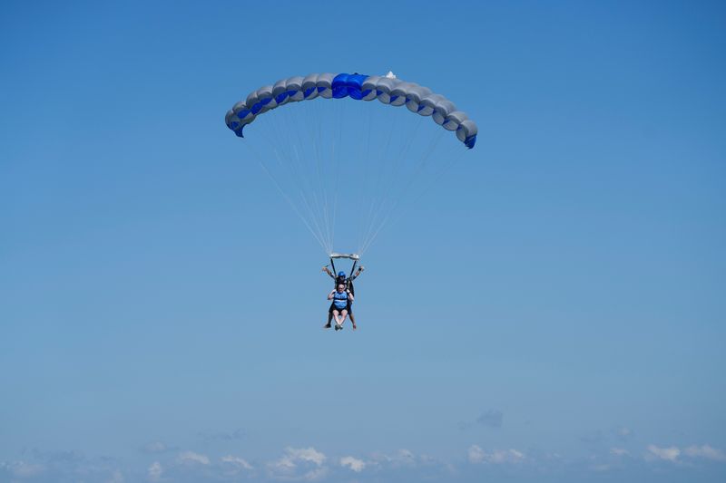 Skydivers descend near Knoxville in July 2026.