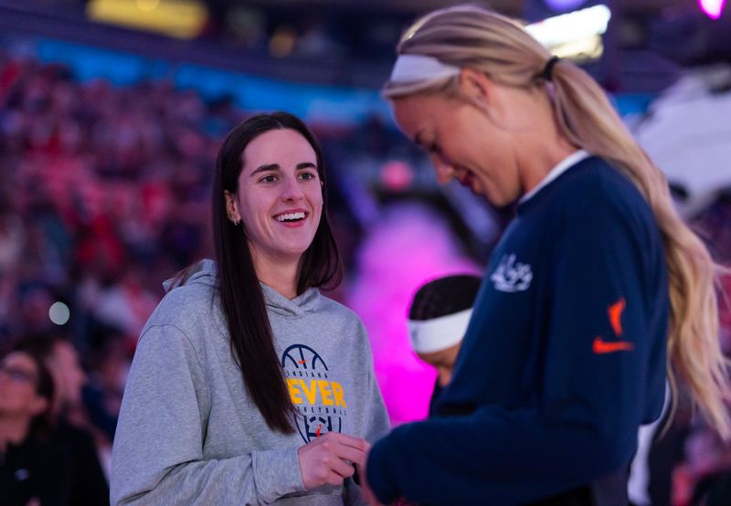 Jul 9, 2026; Phoenix, Arizona, USA; Indiana Fever guard Caitlin Clark (left) with guard Sophie Cunningham against the Phoenix Mercury at Mortgage Matchup Center. Mandatory Credit: Mark J. Rebilas-Imagn Images