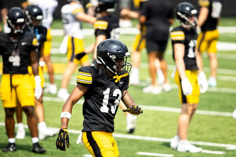 Aug 9, 2025; Iowa wide receiver Terrence Smith (13) warms up during the Hawkeyes Kids Day NCAA football open practice at Kinnick Stadium in Iowa City, Iowa. Mandatory Credit: Joseph Cress for the Des Moines Register