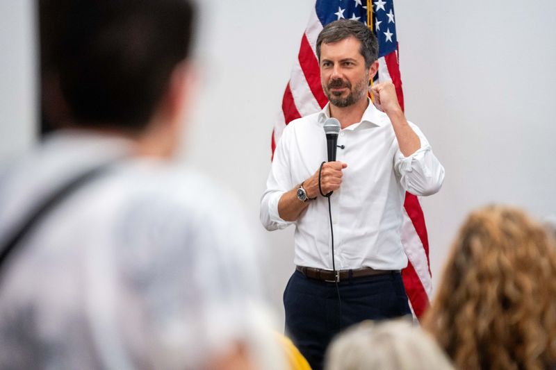 Former U.S. Secretary of Transportation Pete Buttigieg speaks to phone bank volunteers for Sarah Trone Garriott in Des Moines on July 13, 2026,