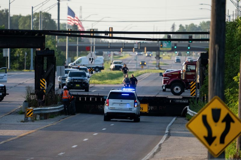 Emergency crews respond to a collapsed railroad bridge over Northwest Second Street on July 17, 2026, in Des Moines.