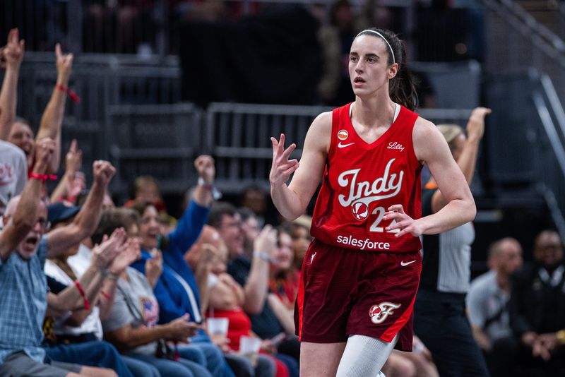Jul 17, 2026; Indianapolis, Indiana, USA; Indiana Fever guard Caitlin Clark (22) gestures after making a three-point shot against the Seattle Storm during the first half at Gainbridge Fieldhouse. Mandatory Credit: Trevor Ruszkowski-Imagn Images