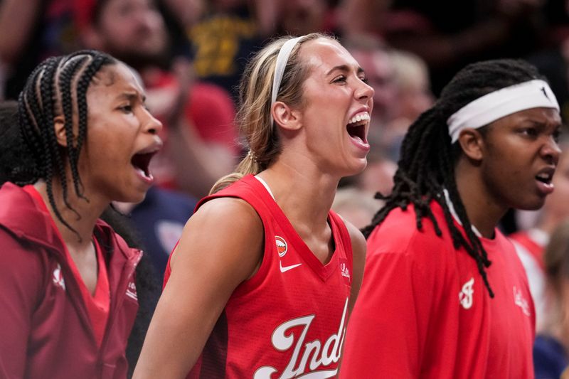 Indiana Fever guard Tyasha Harris (52), Indiana Fever guard Lexie Hull (10) and Indiana Fever forward Myisha Hines-Allen (2) celebrate from the bench Friday, July 17, 2026, during the second half of a game at Gainbridge Fieldhouse in Indianapolis. The Indiana Fever defeated the Seattle Storm, 110-107.