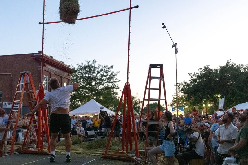 Iowa Offensive Lineman Cael Winter throws the winning toss in the Solon Beef Days Hay Bale Toss contest July 17, 2026 in Solon, Iowa.
