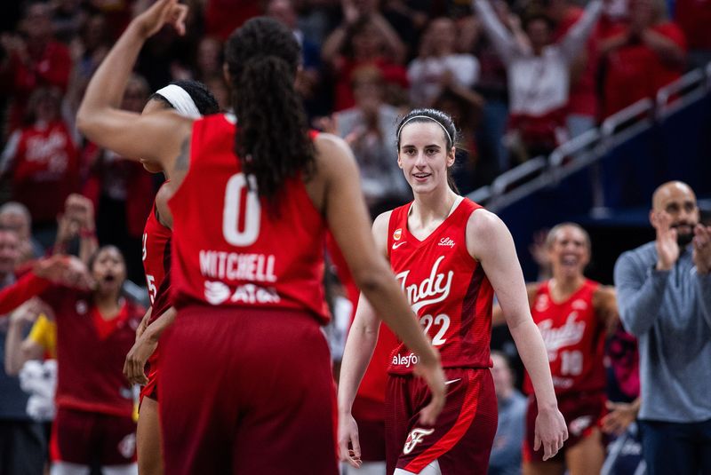 Jul 17, 2026; Indianapolis, Indiana, USA; Indiana Fever guard Caitlin Clark (22) reacts after making a basket against the Seattle Storm in the final seconds of the second half  at Gainbridge Fieldhouse. Mandatory Credit: Trevor Ruszkowski-Imagn Images
