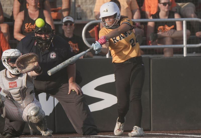 Southeast Polk's Karter Price (24) and the rest of the Rams defeated Valley in an elimination game at the state softball tournament Wednesday.