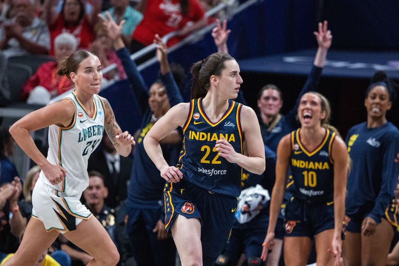 Jul 18, 2026; Indianapolis, Indiana, USA; Indiana Fever guard Caitlin Clark (22) celebrates a made basket in the second half against the New York Liberty at Gainbridge Fieldhouse. Mandatory Credit: Trevor Ruszkowski-Imagn Images