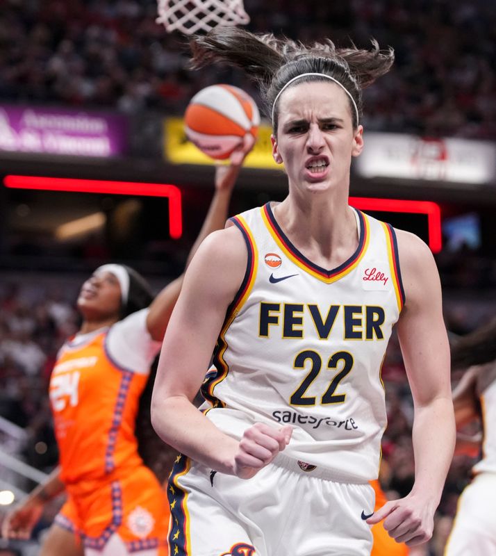 Indiana Fever guard Caitlin Clark (22) celebrates after scoring Wednesday, July 22, 2026, during a game at Gainbridge Fieldhouse in Indianapolis.