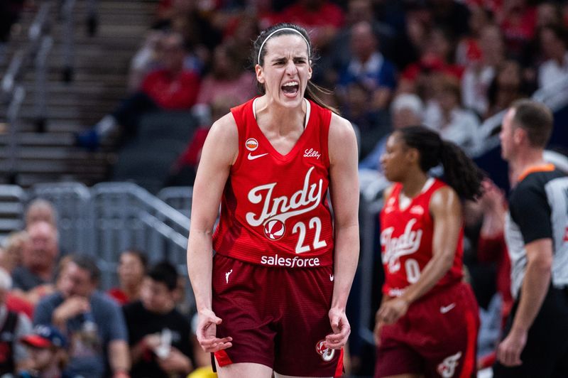 Jul 17, 2026; Indianapolis, Indiana, USA; Indiana Fever guard Caitlin Clark (22) reacts against the Seattle Storm during the first half at Gainbridge Fieldhouse. Mandatory Credit: Trevor Ruszkowski-Imagn Images