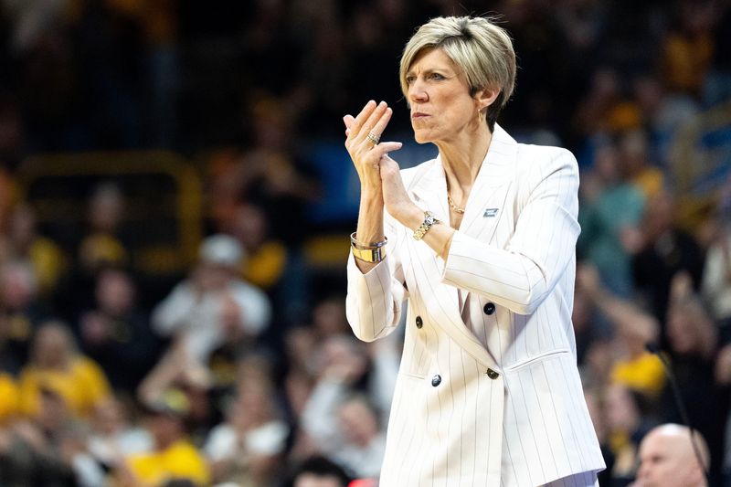 Iowa head coach Jan Jensen coaches her team against the Virginia Cavaliers during a Round of 32 NCAA March Madness game at Carver-Hawkeye Arena in Iowa City, Iowa on March 23, 2026.