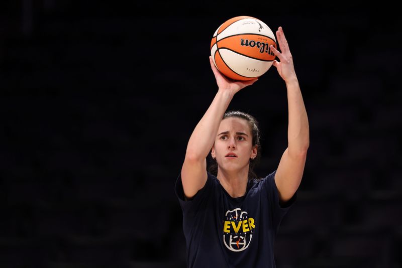 Jul 8, 2026; Los Angeles, California, USA;  Indiana Fever guard Caitlin Clark (22) warms up before the game against the Los Angeles Sparks at Crypto.com Arena. Mandatory Credit: Kiyoshi Mio-Imagn Images