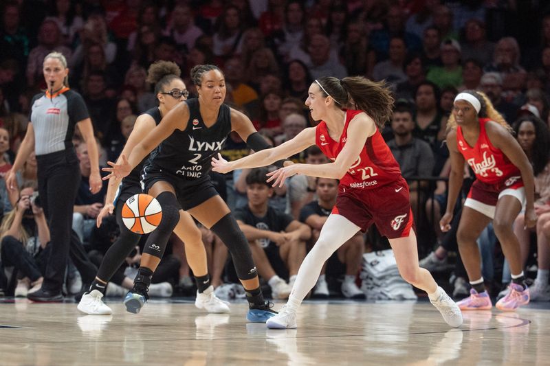 Aug 2, 2026; Minneapolis, Minnesota, USA; Indiana Fever guard Caitlin Clark (22) passes past the defense of Minnesota Lynx forward Napheesa Collier (24) in the second quarter at Target Center. Mandatory Credit: Matt Blewett-Imagn Images