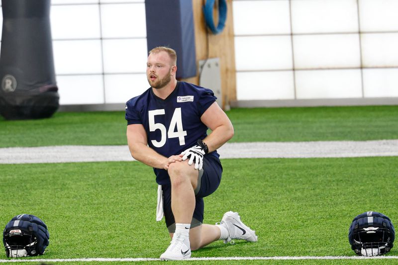 May 8, 2026; Lake Forest, IL, USA; Chicago Bears offensive lineman Logan Jones (54) stretches during Rookie Minicamp at Halas Hall. Mandatory Credit: Kamil Krzaczynski-Imagn Images