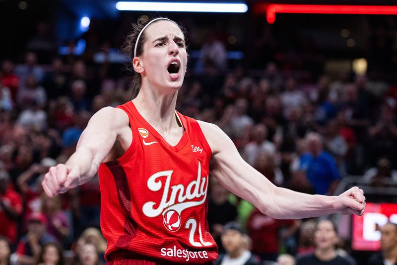 Aug 6, 2026; Indianapolis, Indiana, USA; Indiana Fever guard Caitlin Clark (22) reacts after making a basket against the Las Vegas Aces during the second half of a game at Gainbridge Fieldhouse. Mandatory Credit: Trevor Ruszkowski-Imagn Images