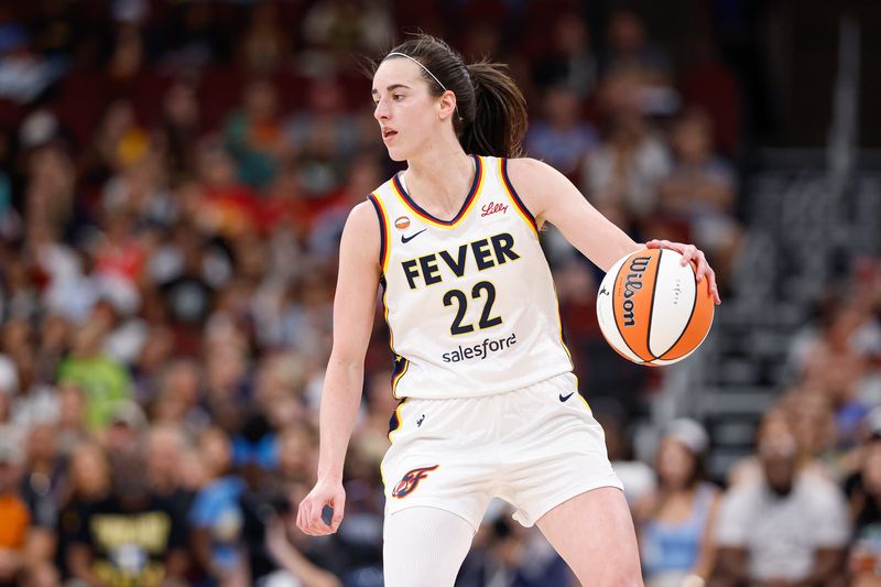 Aug 8, 2026; Chicago, Illinois, USA; Indiana Fever guard Caitlin Clark (22) brings the ball up court against the Chicago Sky during the first half at United Center. Mandatory Credit: Kamil Krzaczynski-Imagn Images