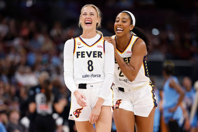 Aug 8, 2026; Chicago, Illinois, USA; Indiana Fever guard Sophie Cunningham (8) and forward Monique Billings (25) smile during the first half of a game against the Chicago Sky at the United Center. Mandatory Credit: Kamil Krzaczynski-Imagn Images