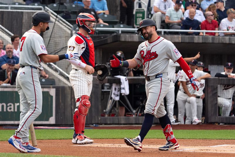 Philadelphia Phillies designated hitter Kyle Schwarber (12) high-fives teammates after hitting a lead off home run in the top of the First Inning Aug. 13, 2026 at the Field of Dreams in Dyersville, Iowa.