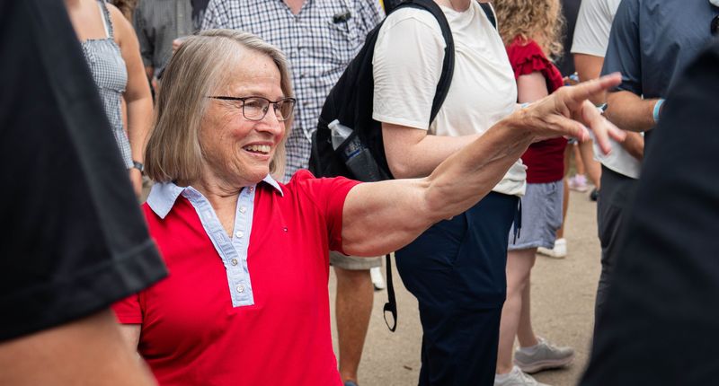 Republican U.S. Rep. Mariannette Miller-Meeks waves at a supporter Saturday, Aug. 15, outside the Cattle Barn at the Iowa State Fair.