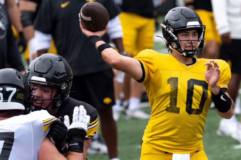 Iowa quarterback Jeremy Hecklinski (10) throws a pass Aug. 15, 2026 during the Kids Day at Kinnick open practice at Kinnick Stadium in Iowa City, Iowa.