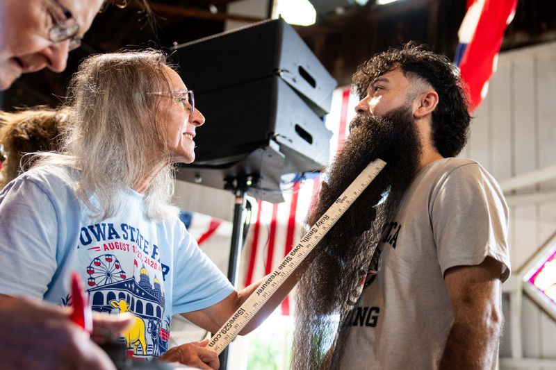 Mulmaro Martinez of West Des Moines has his beard measured during the Iowa State Fair’s beard contest on Aug. 18, 2026, at the Iowa State Fairgrounds.