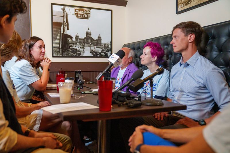 Angie Sylling speaks with Rob Sand, Democratic Gov. candidate, about her experiences as a caregiver, in a moderated discussion, hosted by the American Cancer Society, about cancer in Iowa Tuesday, July 28, 2026 at The Empire in Des Moines.