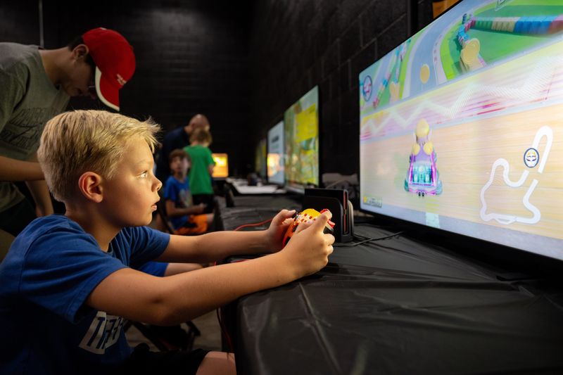 Levi Buell, 8, of Bondurant, plays Mario Kart Aug. 20, 2026, at the Iowa State Fair.