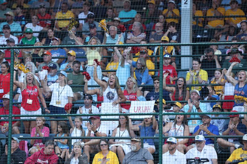Family and friends from Phenix, AL (Southeast Region)  cheer on their team against Bonita, CA (West Region) at the Little League Baseball World Series at Howard J. Lamade Stadium in South Williamsport, PA on Saturday, August 22, 2026.