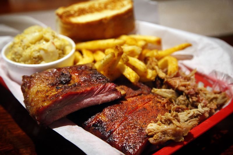 The rib and meat platter with spud sticks and potato casserole for sides is seen at Smokey D's BBQ in Des Moines on Dec. 6, 2013.