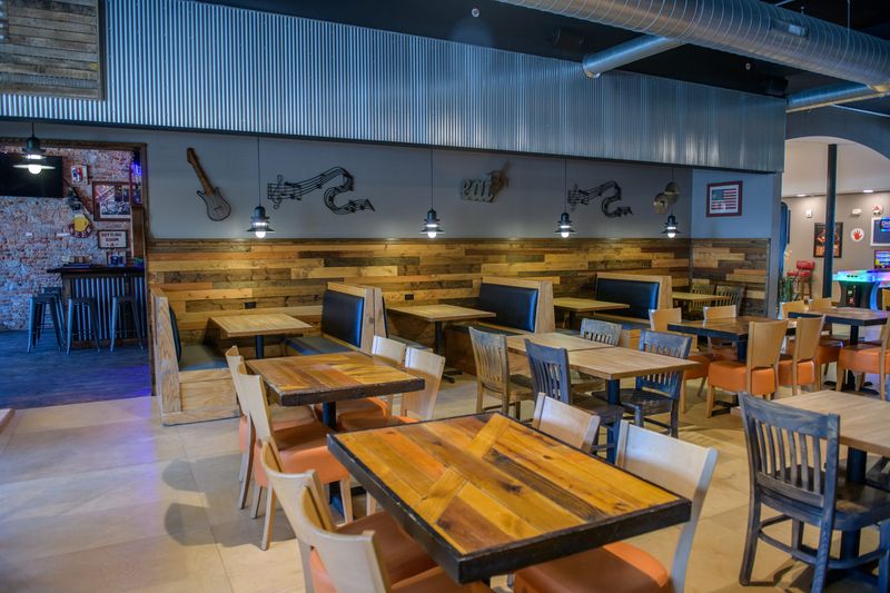 Ashers Bar and Grill in Pekin offers a spacious dining room that opens up into a bar and videogaming area with pool tables and dartboards in the back.