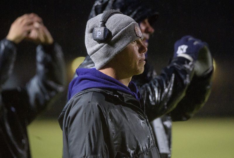 El Paso-Gridley head coach Tanner Benedict watches the Titans take on the Tremont Turks in the first half Friday, Oct. 14, 2022 in Tremont. EP-G defeated Tremont 34-8.