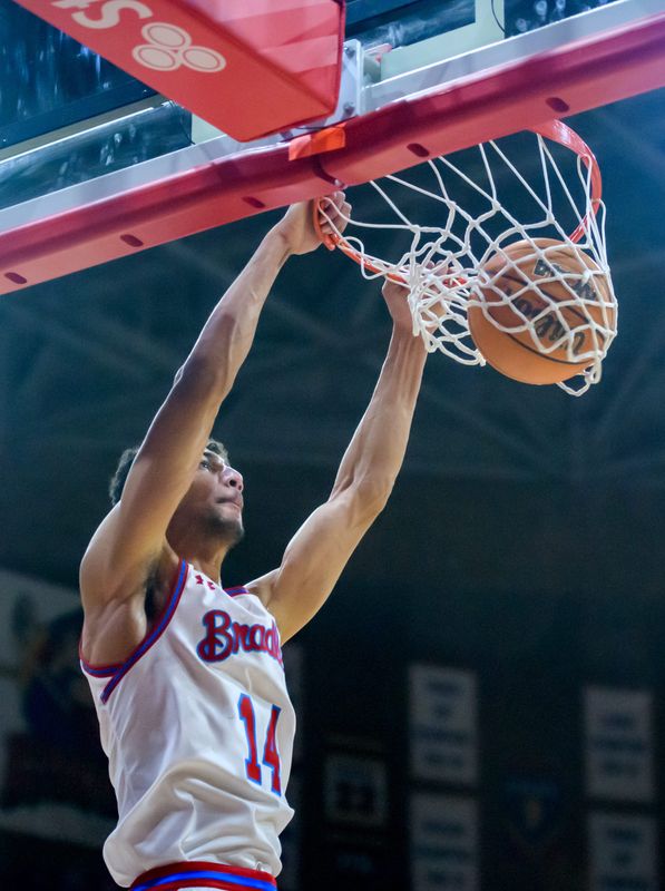 Bradley's Malevy Leons dunks over the SIU defense in the first half Wednesday, Feb. 1, 2023 at Carver Arena.